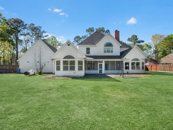 a view of yard from deck having patio
