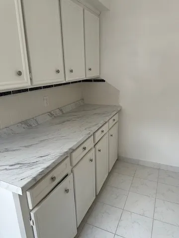 a view of a kitchen with cabinets
