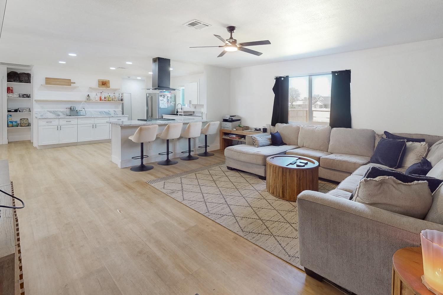 894 Grand Oroville, CA 95965 - Photo 11 of 49 a living room with furniture and a chandelier