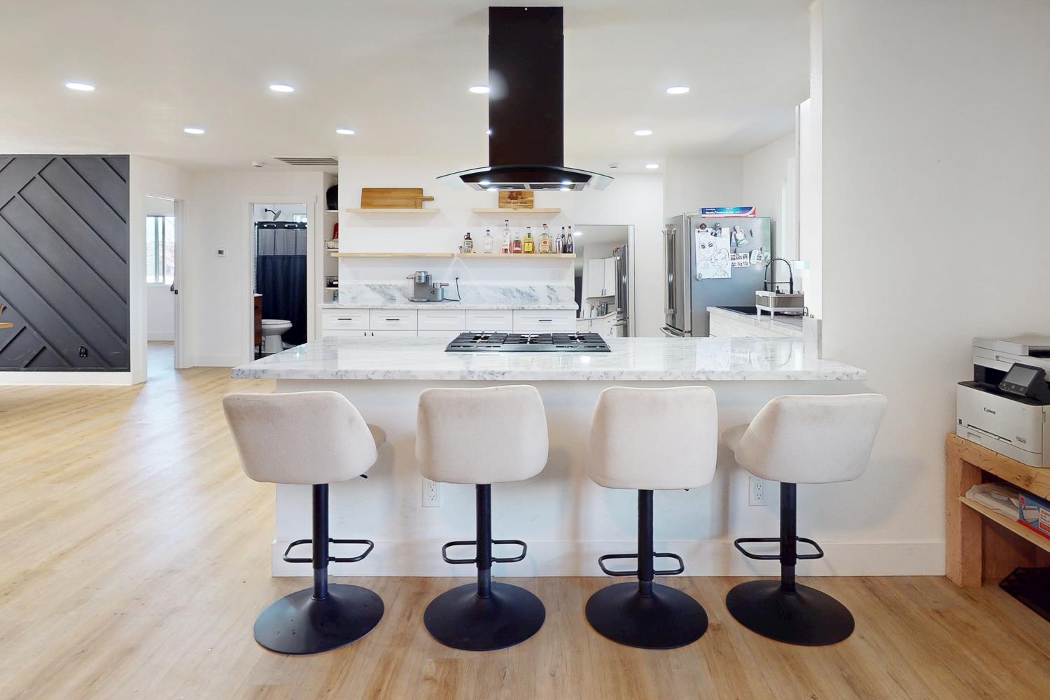 894 Grand Oroville, CA 95965 - Photo 13 of 49 a kitchen with cabinets and chairs