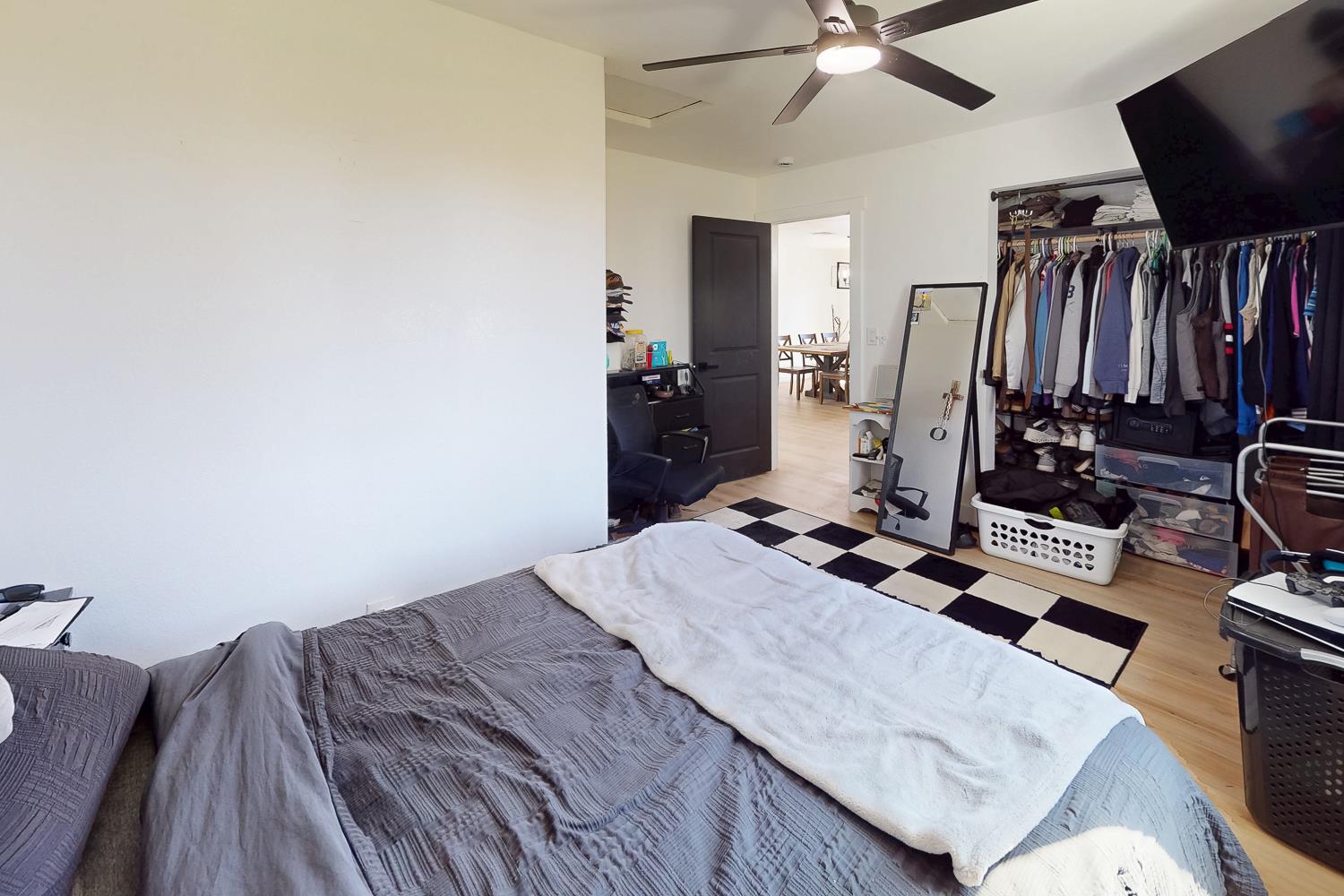 894 Grand Oroville, CA 95965 - Photo 26 of 49 a bedroom with a bed and a flat screen tv