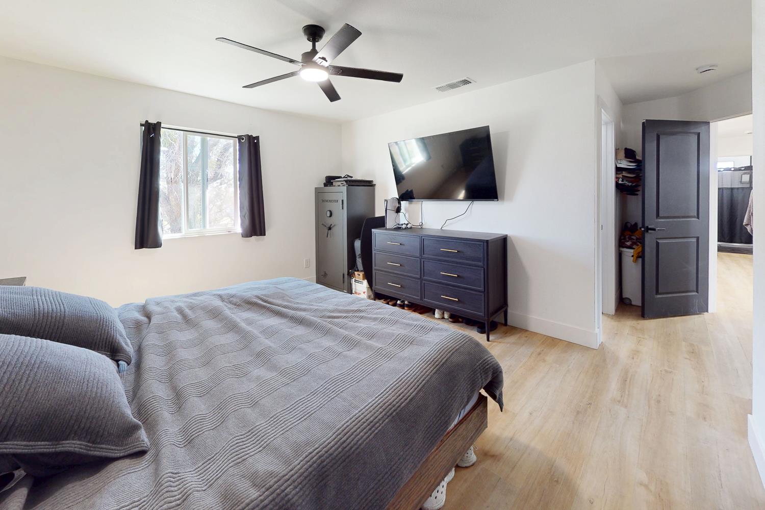 894 Grand Oroville, CA 95965 - Photo 27 of 49 a bedroom with a bed and a flat screen tv