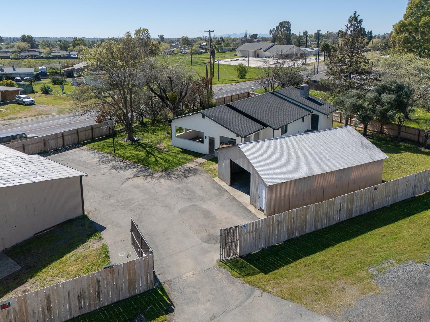 894 Grand Oroville, CA 95965 - Photo 3 of 49 an aerial view of a house with a garden and lake view