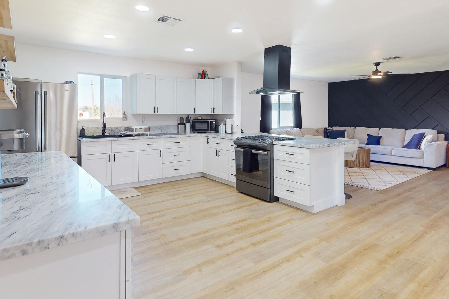 894 Grand Oroville, CA 95965 - Photo 9 of 49 a large kitchen with stainless steel appliances kitchen island granite countertop a sink and cabinets