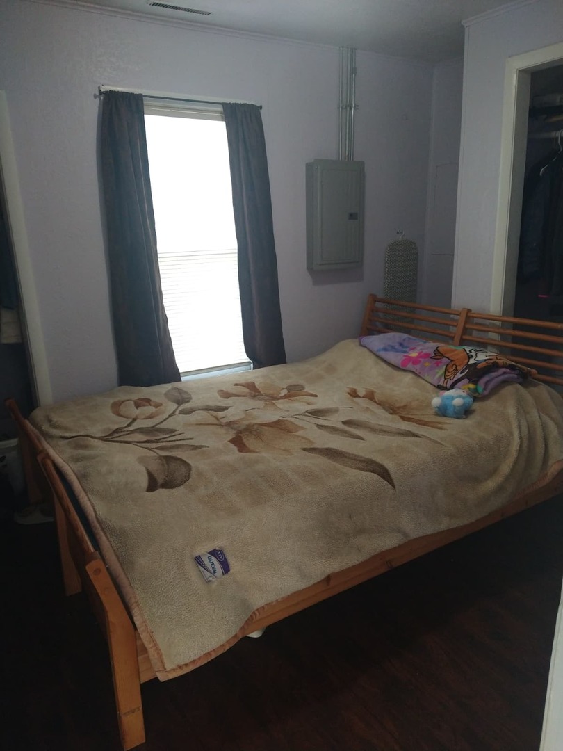 1917 Honore Avenue North Chicago, IL 60064 - Photo 12 of 27 a bedroom with a bed and a window