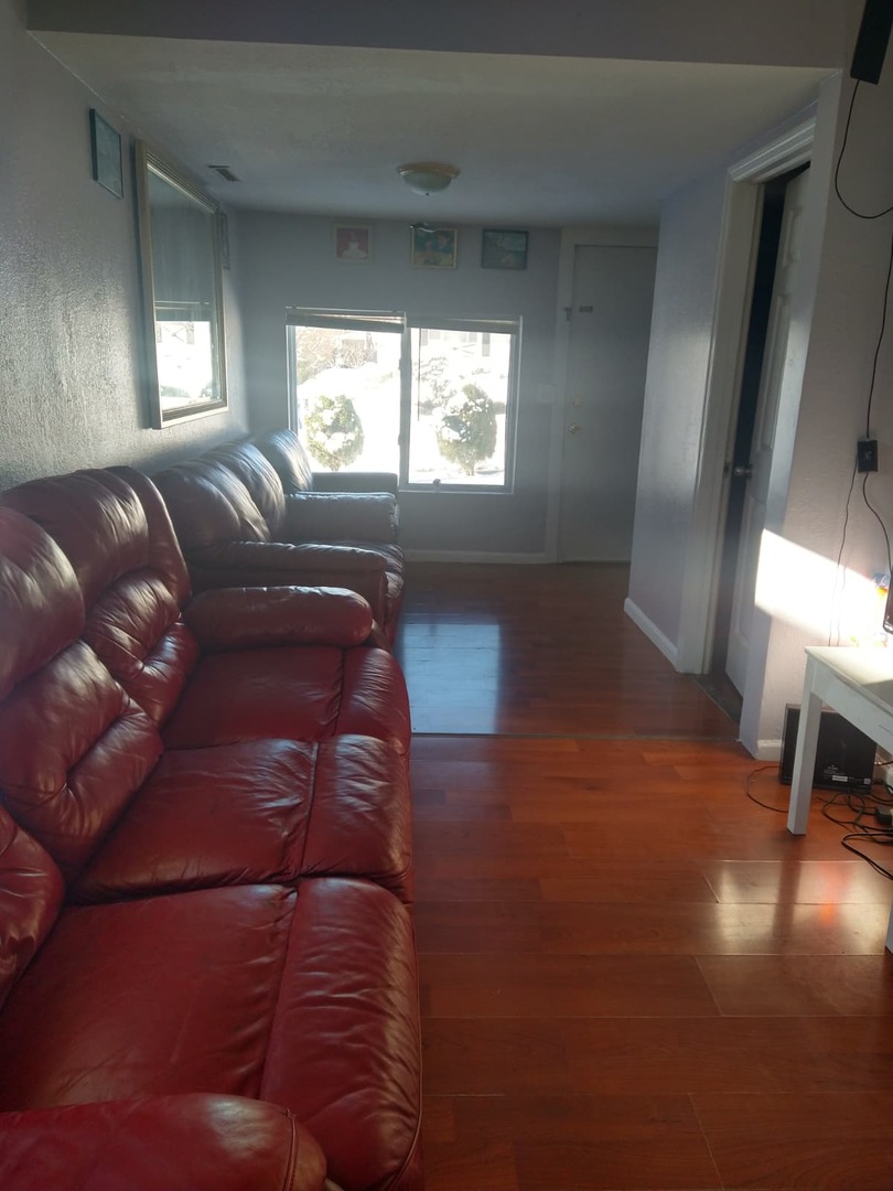 1917 Honore Avenue North Chicago, IL 60064 - Photo 17 of 27 a living room with furniture and a large window