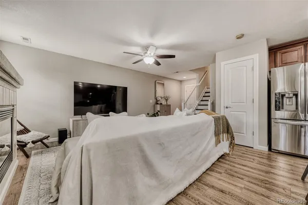a bedroom with a bed and a chandelier