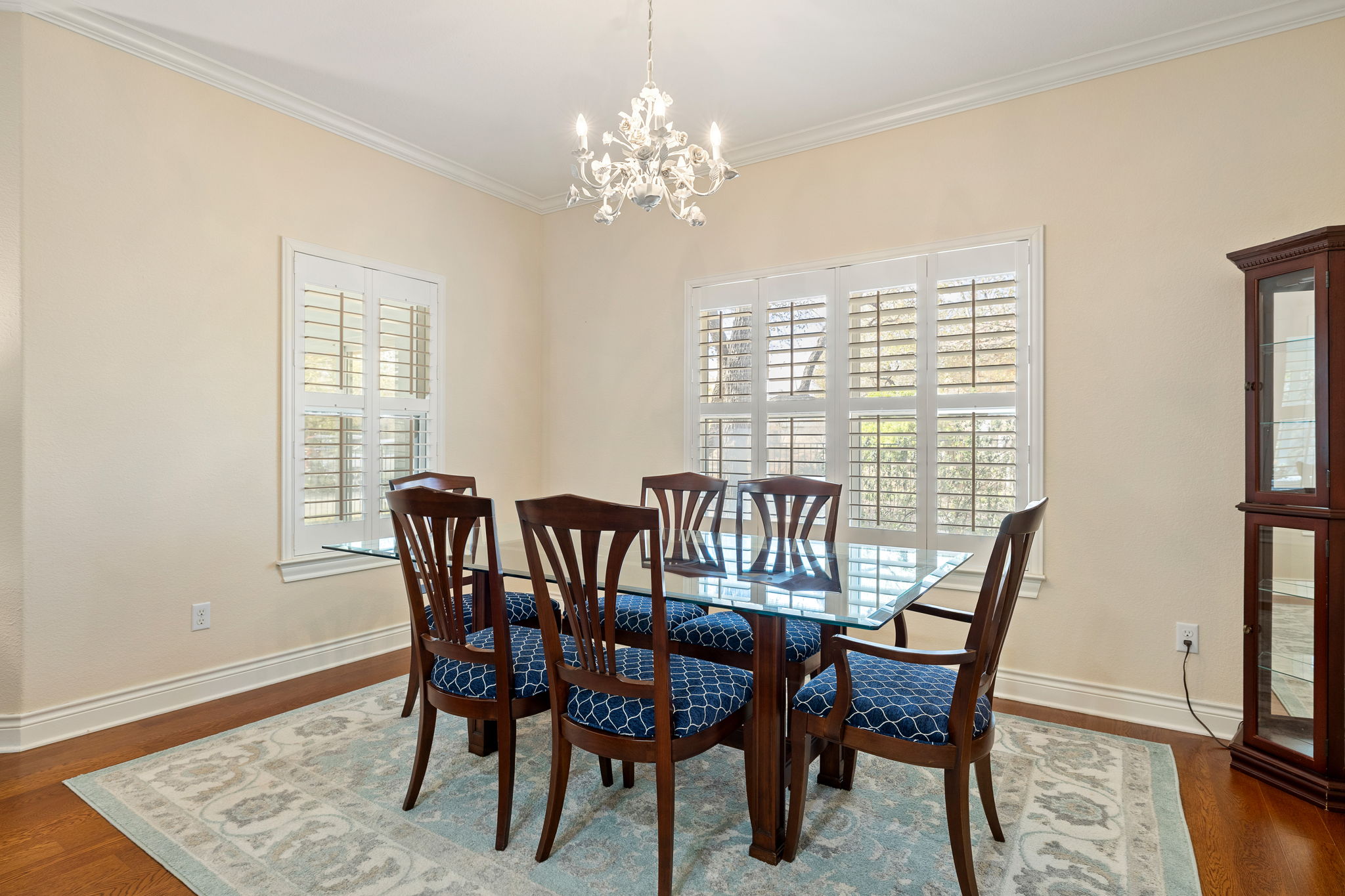 5201 Big Spring Street Georgetown, TX 78633 - Photo 10 of 26 Dining space with dark wood finished floors, crown molding, and suspended lighting
