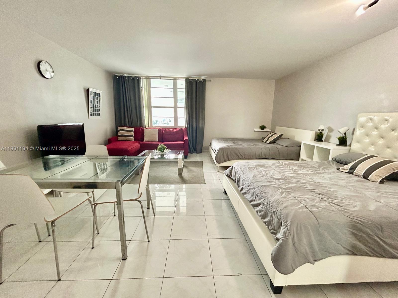 100 Lincoln Road, Unit 1616 Miami Beach, FL 33139 - Photo 3 of 7 a spacious bedroom with a bed and window