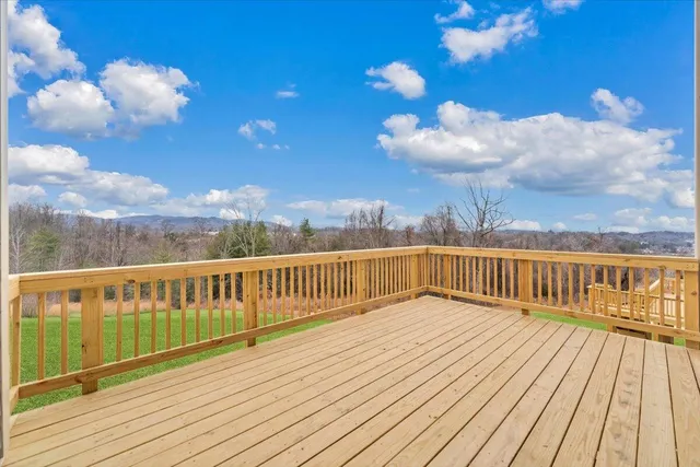 a view of balcony with wooden floor