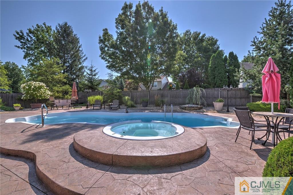 12 Higgins Road Old Bridge, NJ 08857 - Photo 1 of 25 a view of a swimming pool with a patio