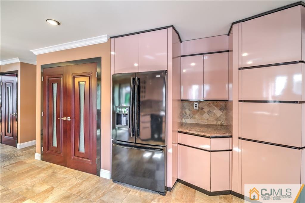 12 Higgins Road Old Bridge, NJ 08857 - Photo 11 of 25 a kitchen with stainless steel appliances granite countertop a refrigerator and a sink