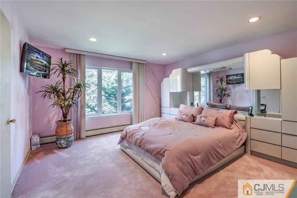 12 Higgins Road Old Bridge, NJ 08857 - Photo 13 of 25 a bedroom with a large bed and a window