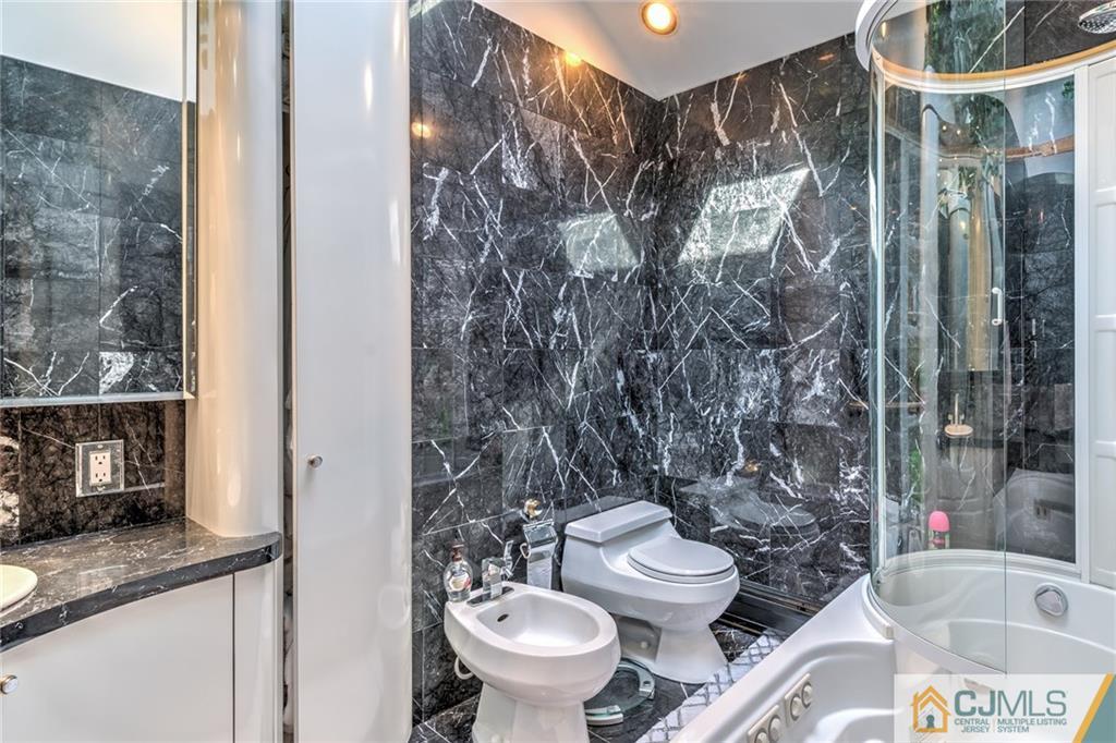 12 Higgins Road Old Bridge, NJ 08857 - Photo 15 of 25 a bathroom with a granite countertop sink toilet and shower