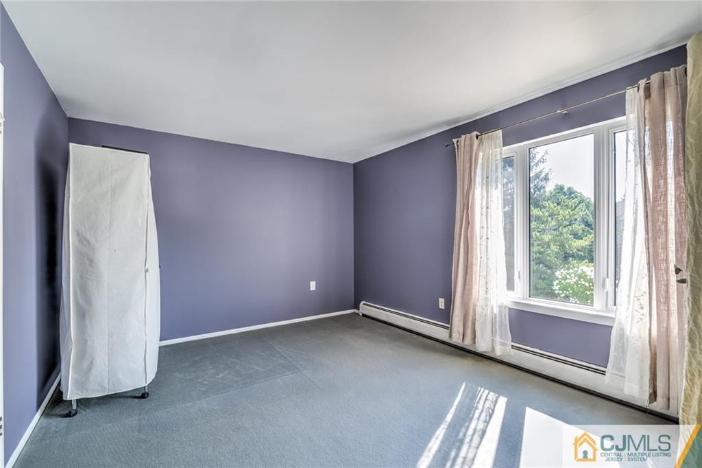 12 Higgins Road Old Bridge, NJ 08857 - Photo 18 of 25 an empty room with windows