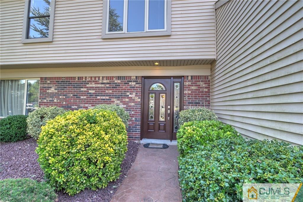 12 Higgins Road Old Bridge, NJ 08857 - Photo 3 of 25 a front view of a house with garden