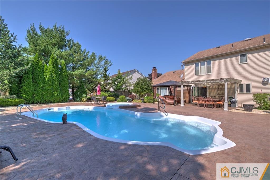 12 Higgins Road Old Bridge, NJ 08857 - Photo 22 of 25 a view of a house with swimming pool