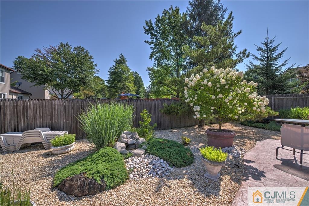 12 Higgins Road Old Bridge, NJ 08857 - Photo 23 of 25 a garden view with a seating space