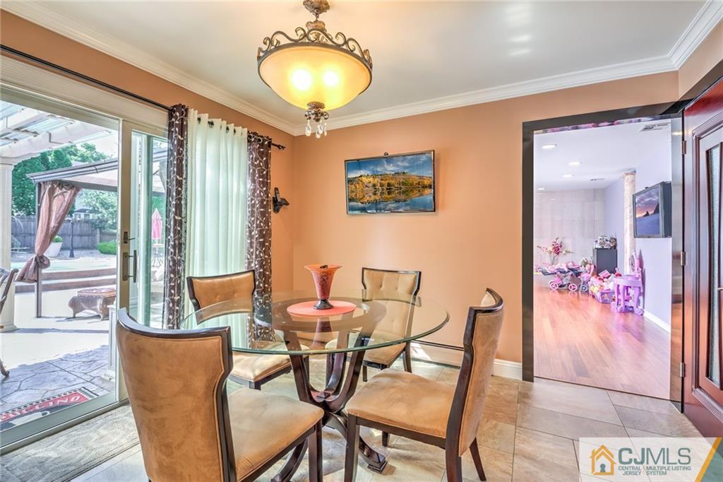 12 Higgins Road Old Bridge, NJ 08857 - Photo 9 of 25 a dining room with furniture and window