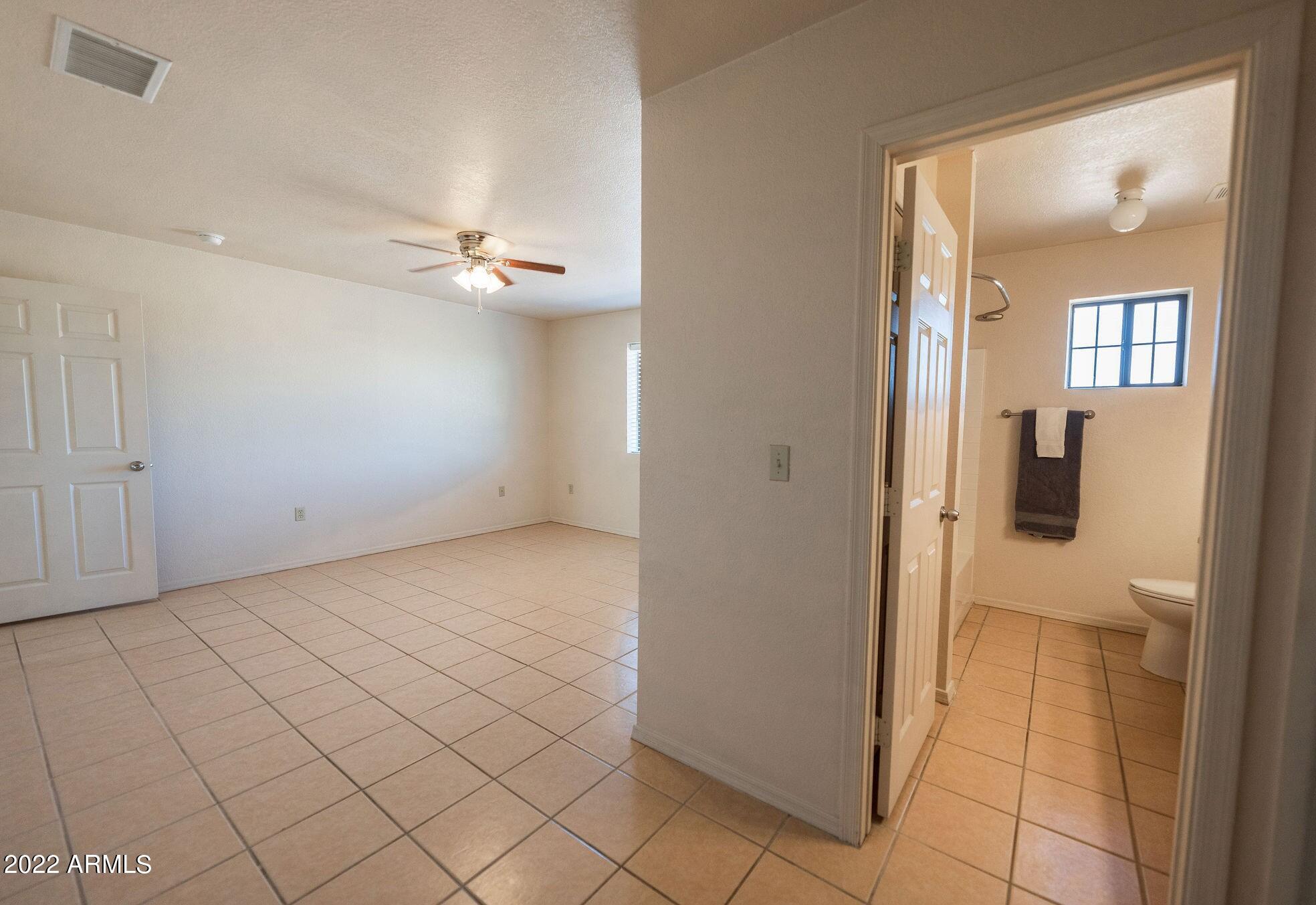 924 Via Puebla Rio Rico, AZ 85648 - Photo 12 of 34 primary bedroom with en suite