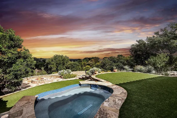 a view of a swimming pool with a yard