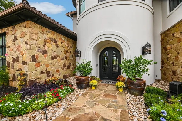 a view of entryway with wooden floor and a front door