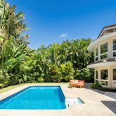 a view of swimming pool with seating area