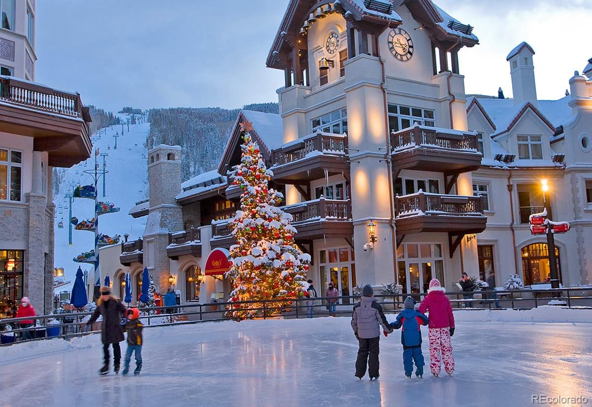 2469 Chamonix Lane, Unit E4 Vail, CO 81657 - Photo 19 of 24 a view of a building with many windows