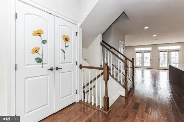 a view of an entryway with wooden floor