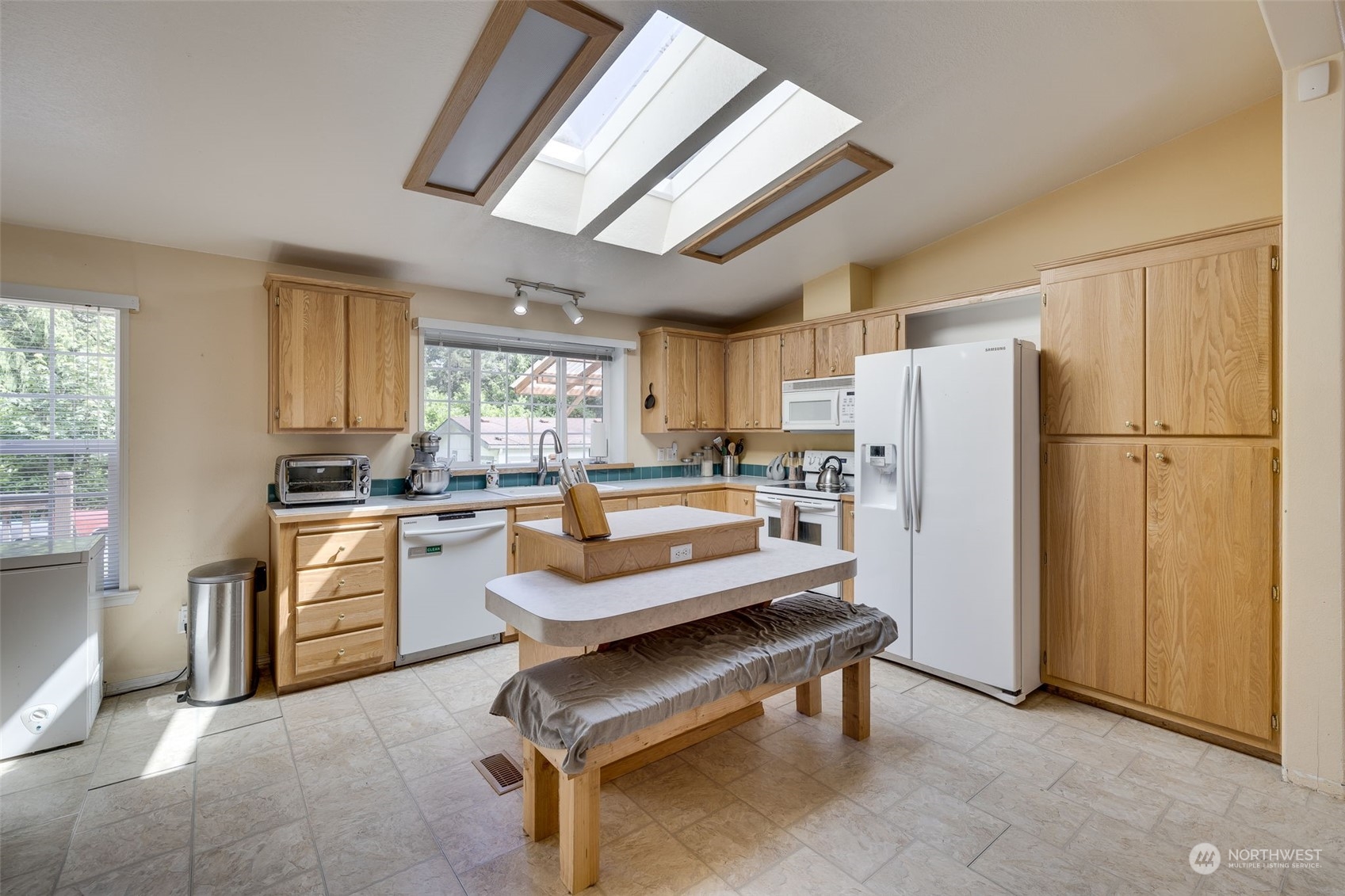 6724 Skinner Road Granite Falls, WA 98252 - Photo 6 of 28 a kitchen with refrigerator a stove a sink and a refrigerator