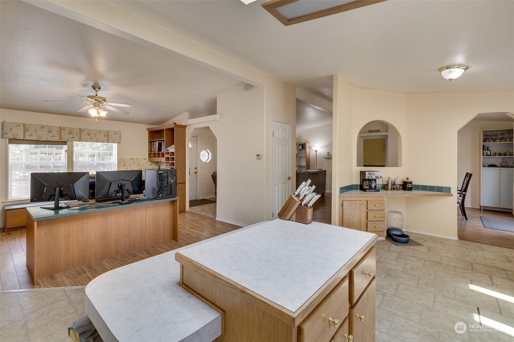 6724 Skinner Road Granite Falls, WA 98252 - Photo 8 of 28 a large kitchen with kitchen island a stove a sink a dining table and chairs