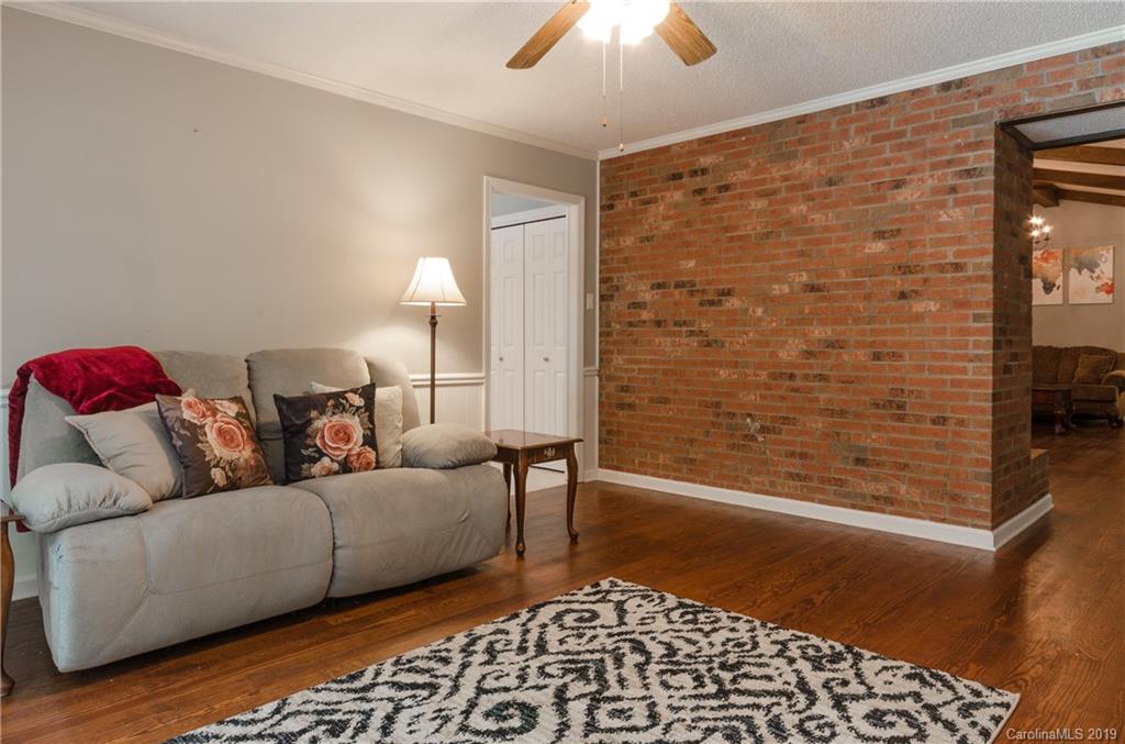 3614 Medlin Road Monroe, NC 28112 - Photo 22 of 33 a living room with furniture and a rug