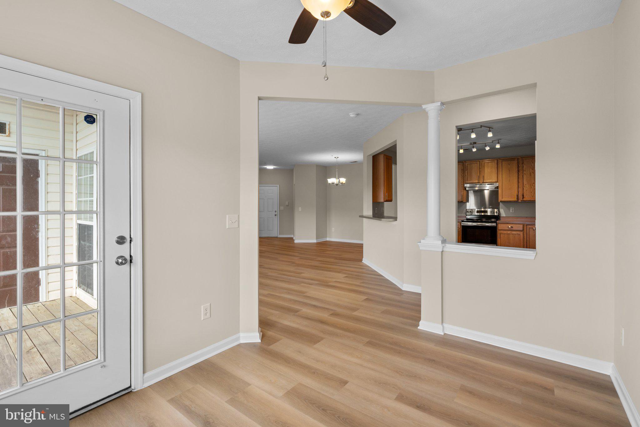 5458 Glenthorne Court, Unit 5458 Baltimore, MD 21237 - Photo 17 of 32 wooden floor in an empty room with a window