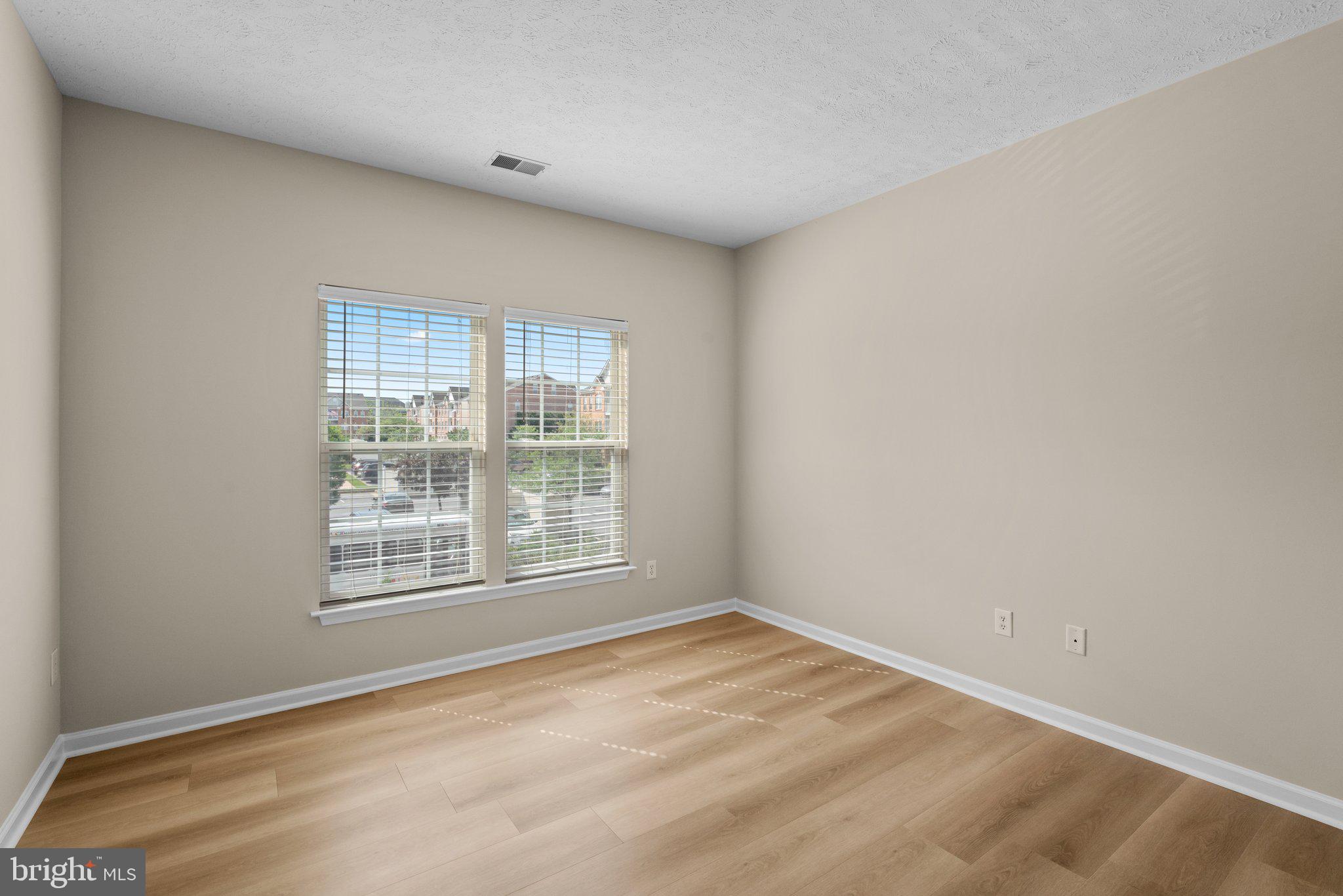 5458 Glenthorne Court, Unit 5458 Baltimore, MD 21237 - Photo 18 of 32 an empty room with a window