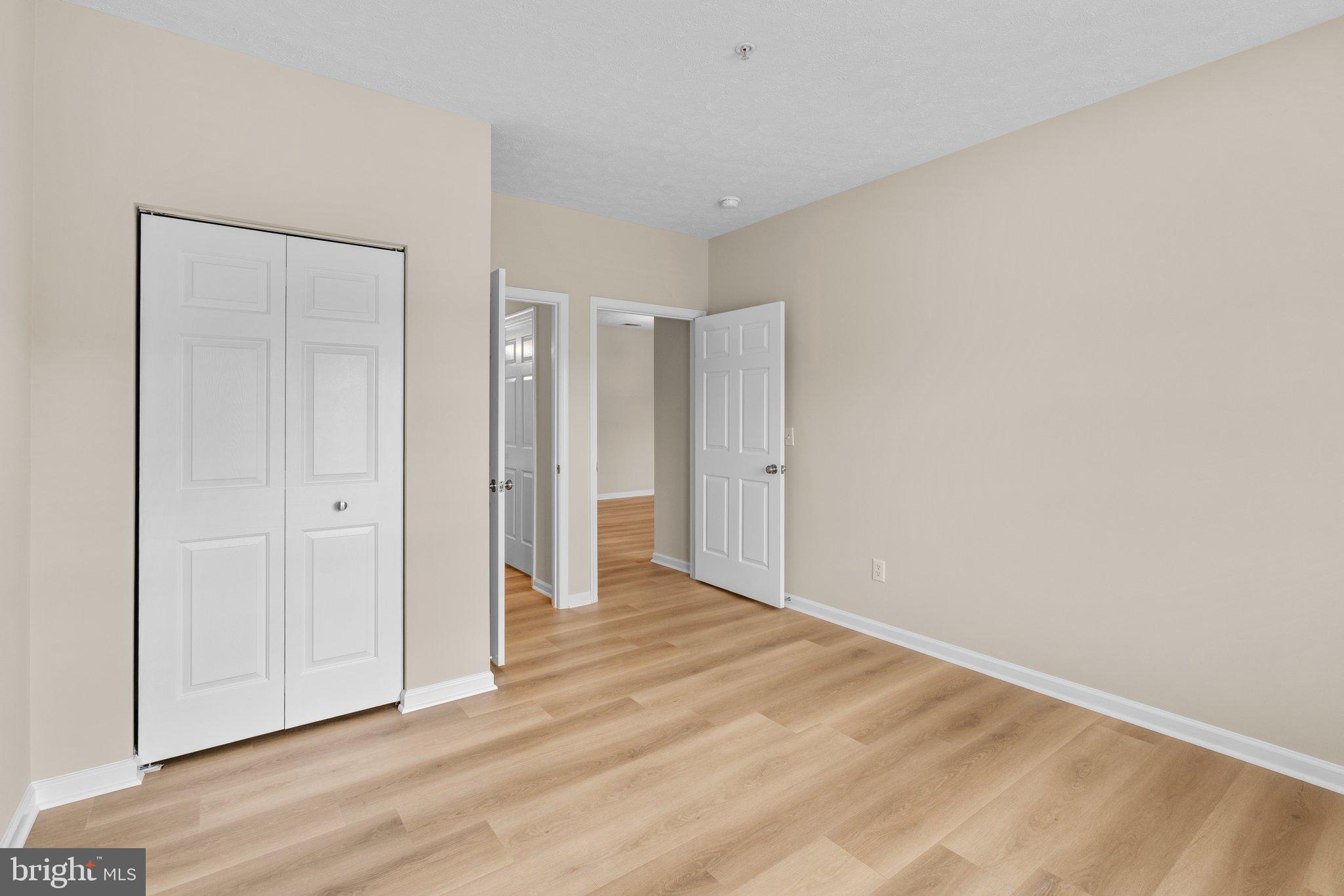 5458 Glenthorne Court, Unit 5458 Baltimore, MD 21237 - Photo 20 of 32 a view of an empty room with wooden floor and closet