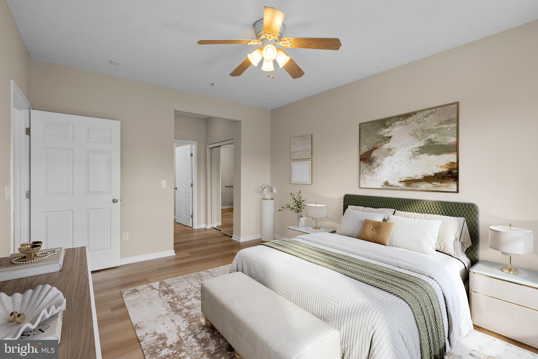 5458 Glenthorne Court, Unit 5458 Baltimore, MD 21237 - Photo 24 of 32 a bedroom with a bed and a chandelier