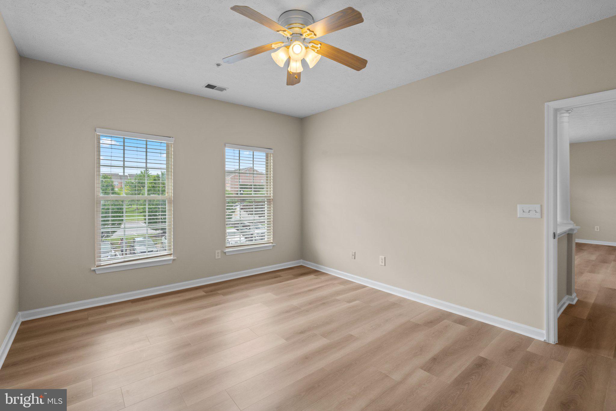 5458 Glenthorne Court, Unit 5458 Baltimore, MD 21237 - Photo 26 of 32 a view of room with window and ceiling fan