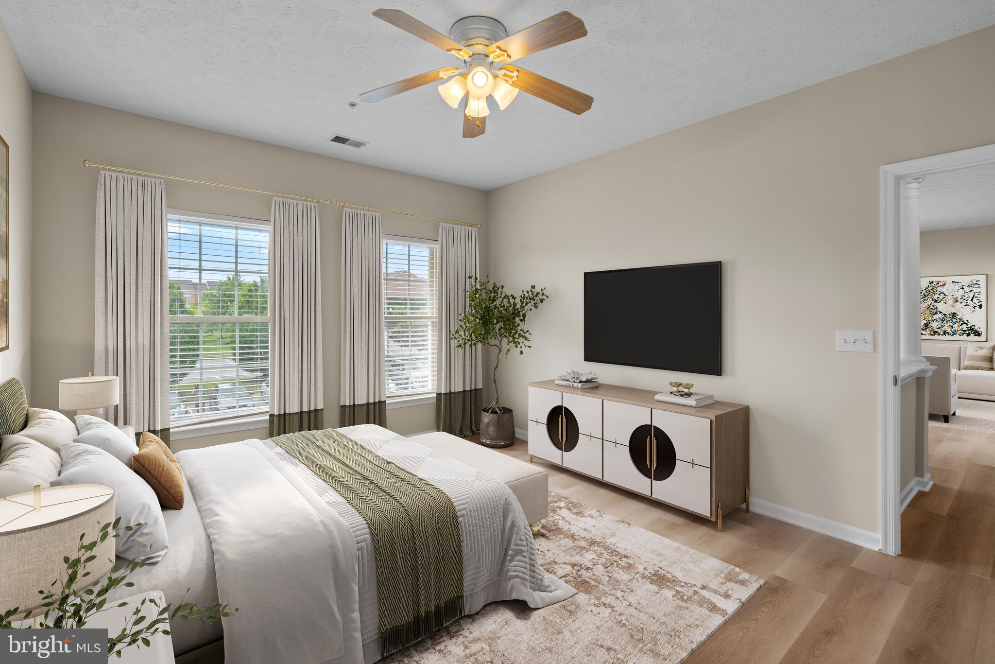5458 Glenthorne Court, Unit 5458 Baltimore, MD 21237 - Photo 27 of 32 a bedroom with a bed and a flat screen tv