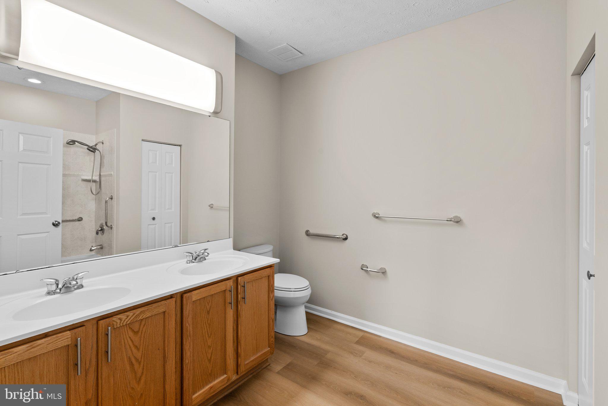 5458 Glenthorne Court, Unit 5458 Baltimore, MD 21237 - Photo 29 of 32 a bathroom with a sink and a mirror