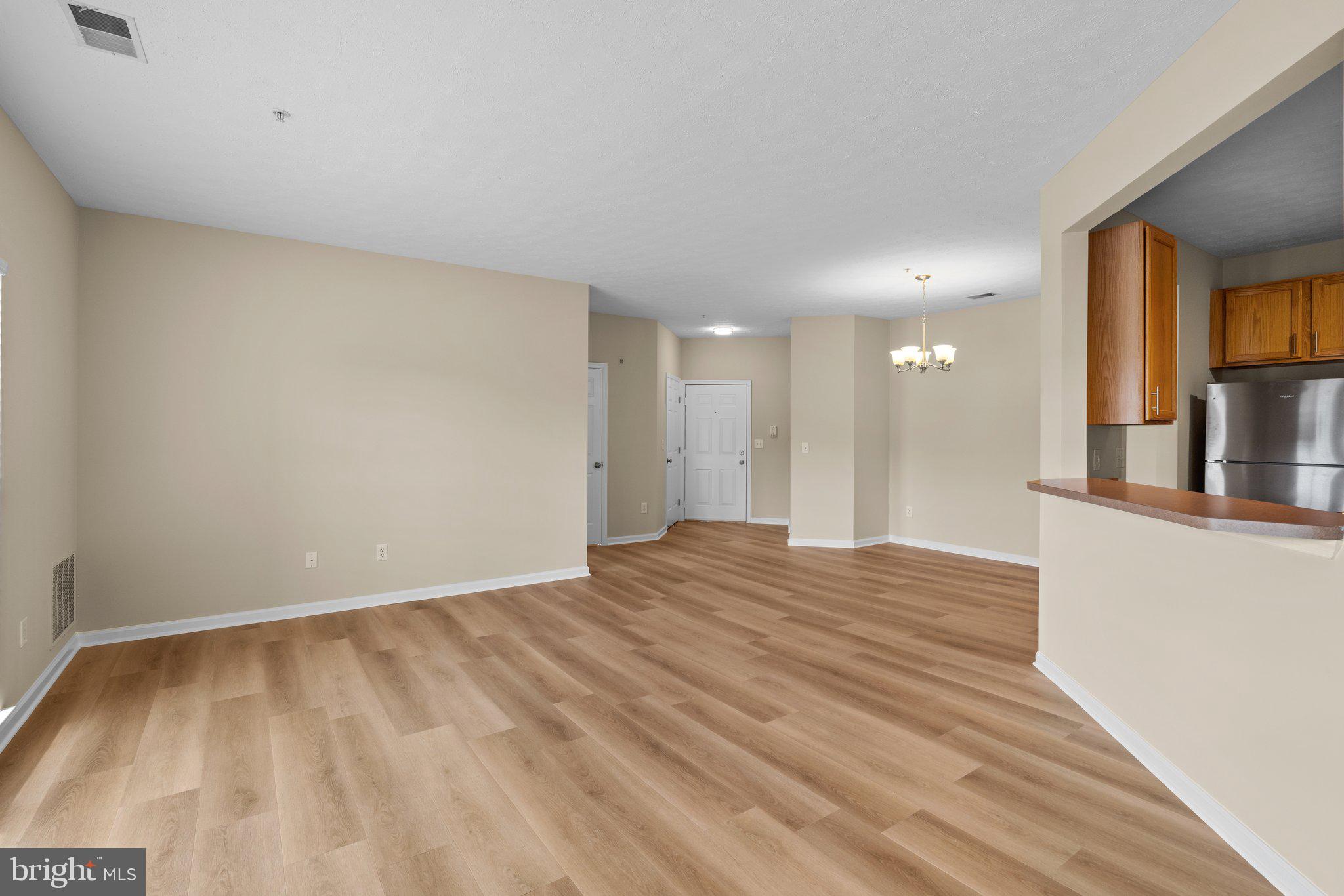 5458 Glenthorne Court, Unit 5458 Baltimore, MD 21237 - Photo 5 of 32 a view of an empty room and wooden floor