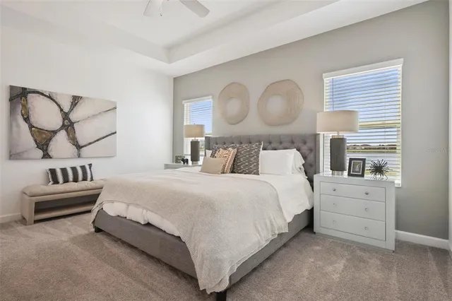 a bedroom with a bed and dresser with mirror