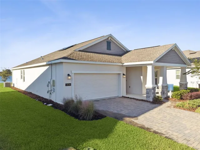 a living room with furniture a rug and a window