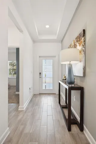 a view of a room with wooden floor cabinet and window