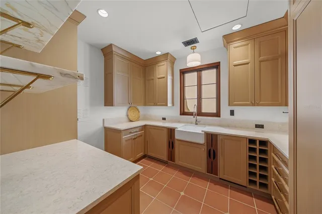 a dining room with furniture and a chandelier