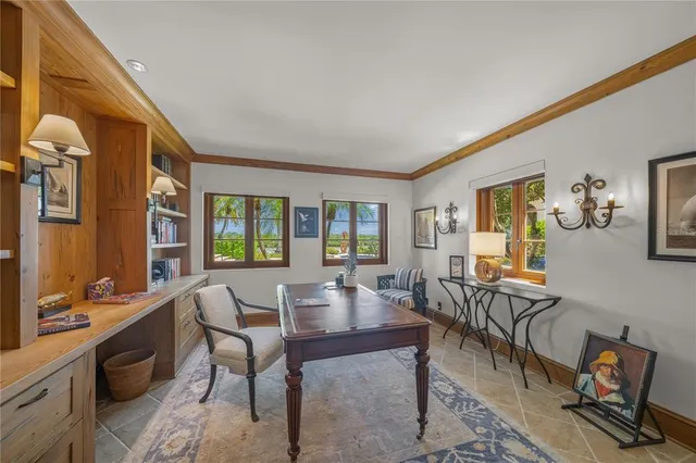 a spacious bathroom with a granite countertop sink mirror and bathtub