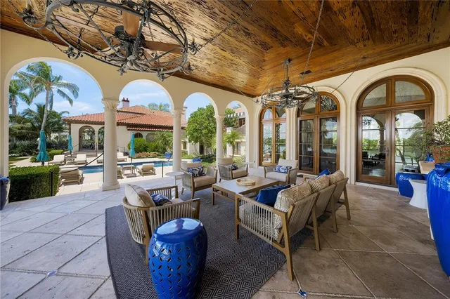 a en suite bathroom with double vanity a large mirror a vanity a window and a bathtub
