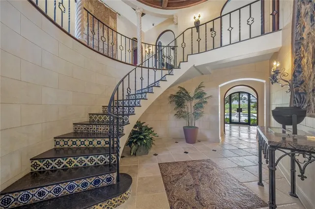 a view of a patio with table and chairs potted plants