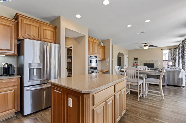 a kitchen with granite countertop a stove and a sink