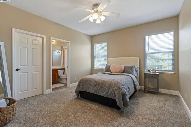 a bathroom with a double vanity sink and a bathtub