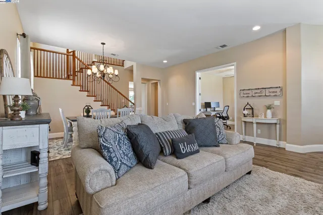 a view of a livingroom with furniture window and wooden floor